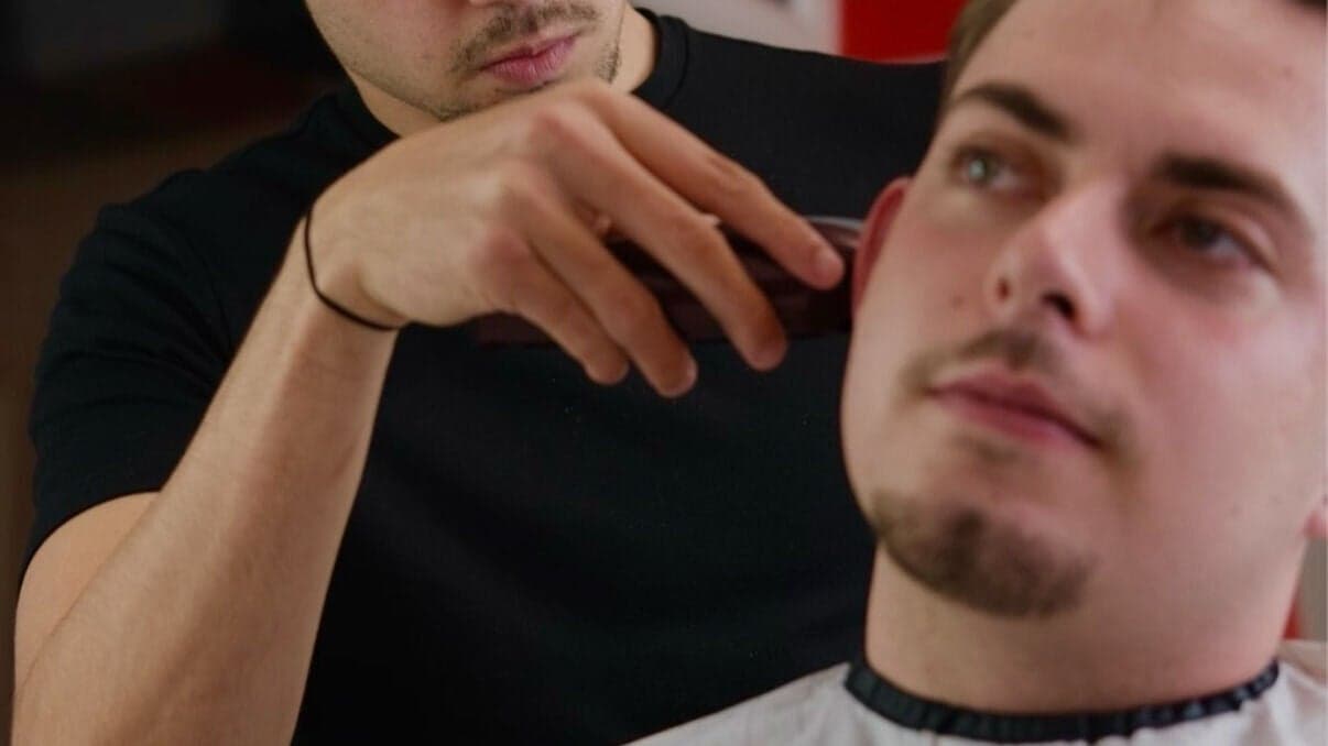 Sharp low fade with beard blend