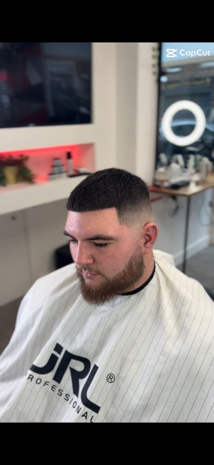 Fresh skin fade with a full beard, front view