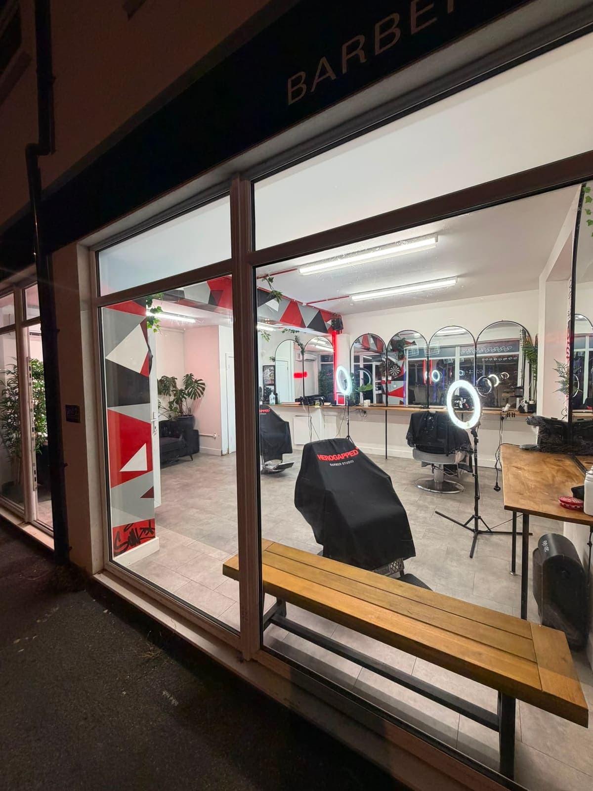 The studio shopfront on London Road lit up at night